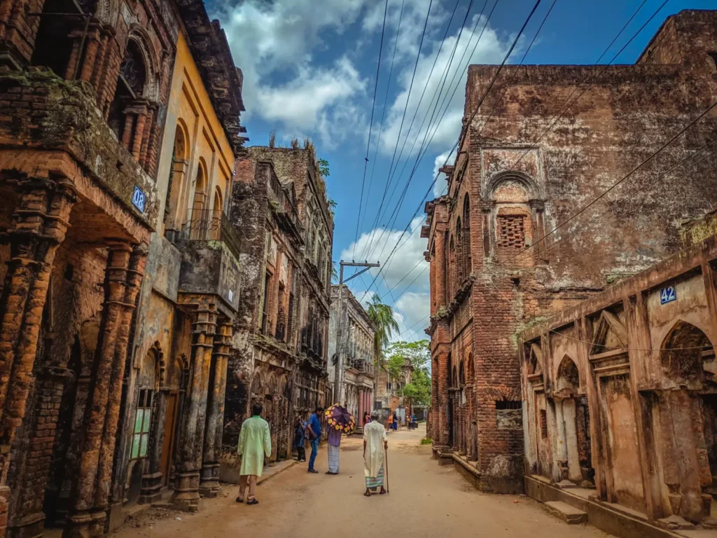 Narrow historic street lined with old brick buildings